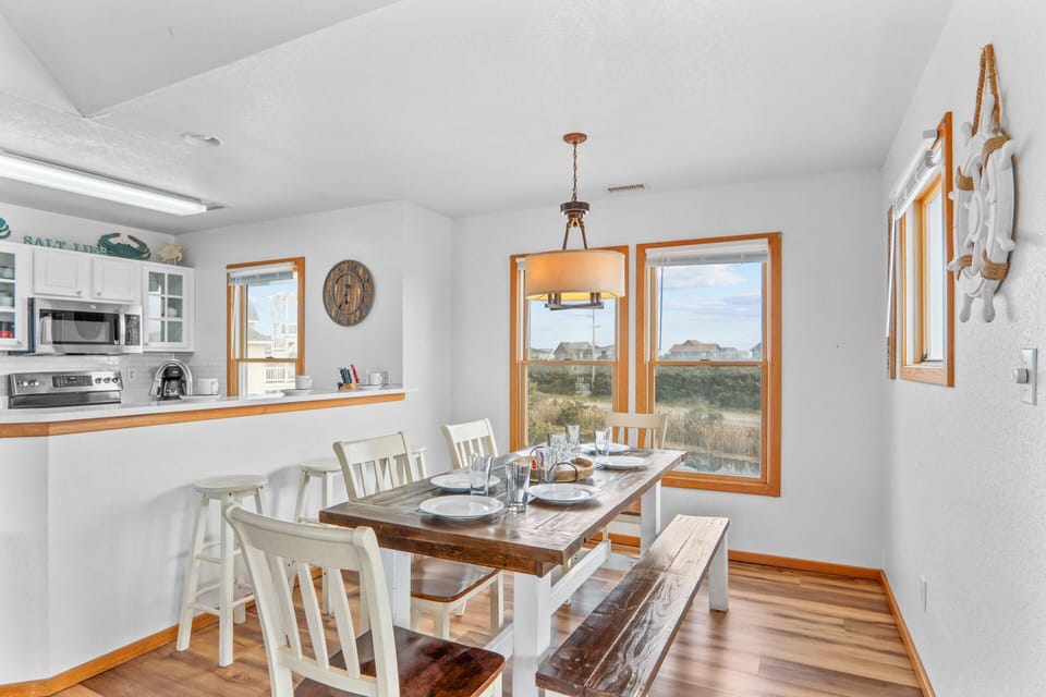 An elegant dining room featuring ample seating, perfect for gatherings and memorable meals.