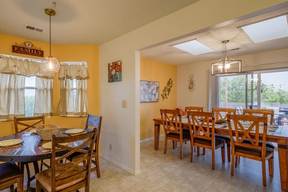 Seating for 6 at the main table, 4 more at the kitchen and 6 on the patio.