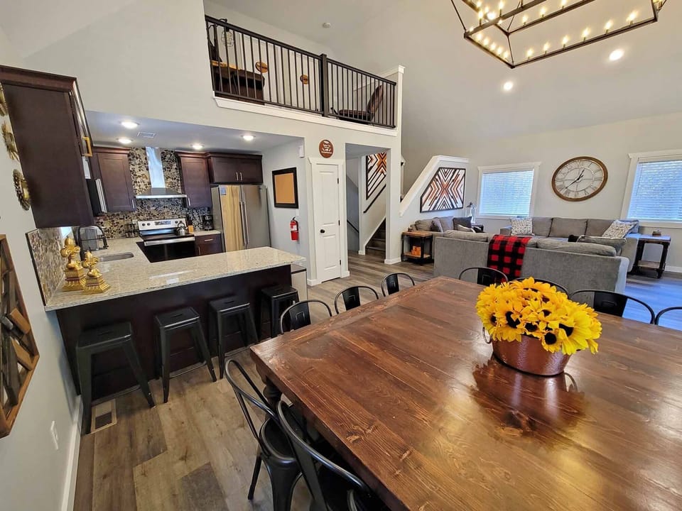 The open concept kitchen features an island with bar stool seating for four.