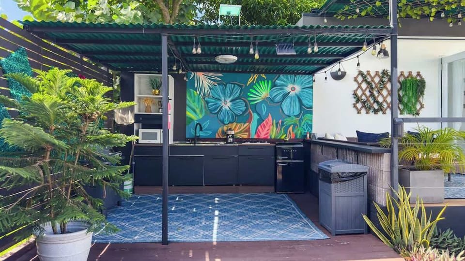 The outdoor kitchen is uniquely designed to enjoy the exterior spaces while you prepare your favorite meals. The kitchen features a 4 burner stovetop, small fridge, coffee maker, microwave and all you need to enjoy al fresco cooking and dining.