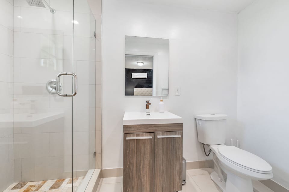 Modern bathroom with a spacious glass-enclosed