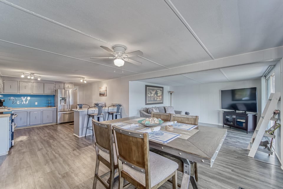 Living, Dining and Kitchen space with Smart TV
