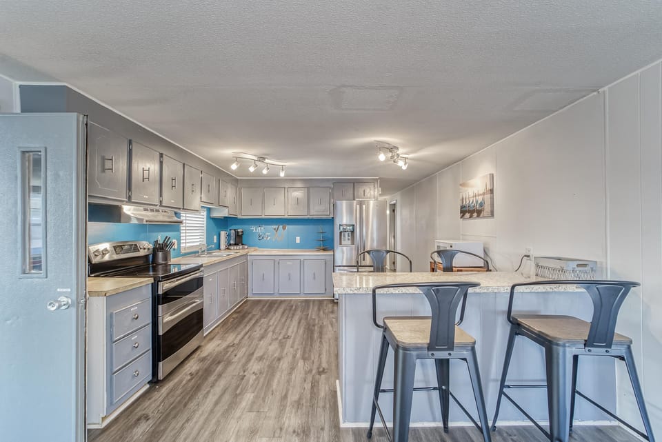 Kitchen includes Keurig Coffee maker, plates, pots, pans, silverware and more