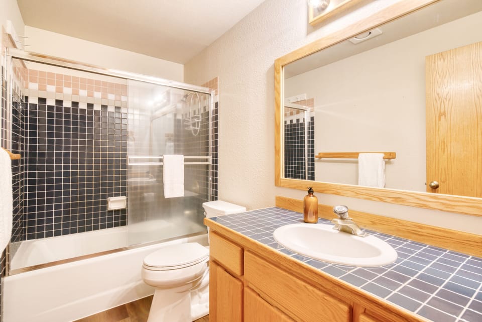 Bathroom 2 features a shower/tub combo.