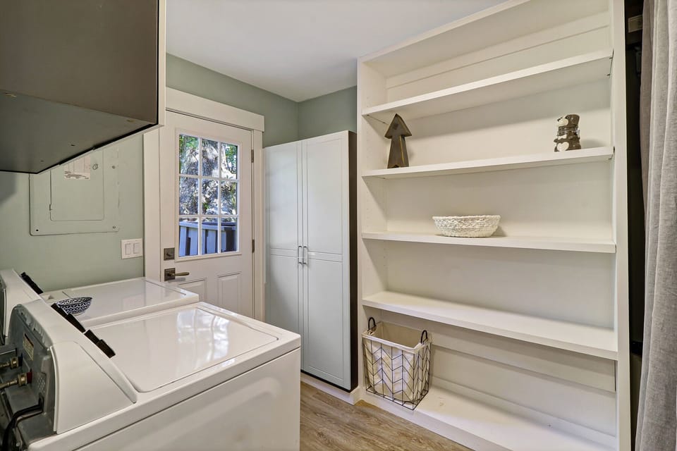 Laundry room with door to pool deck