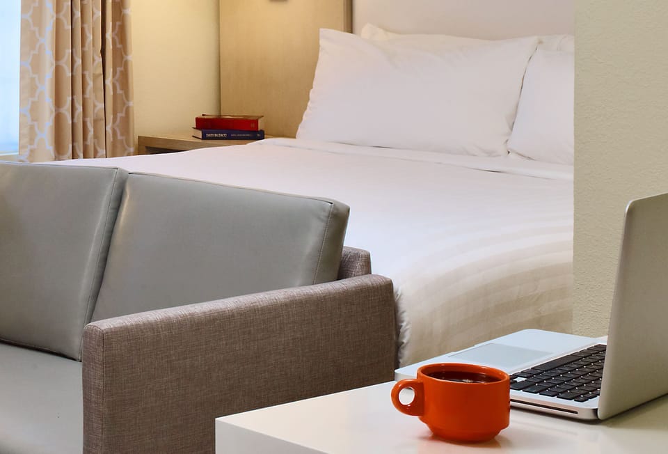 Start your morning with coffee at the desk, bed steps away.