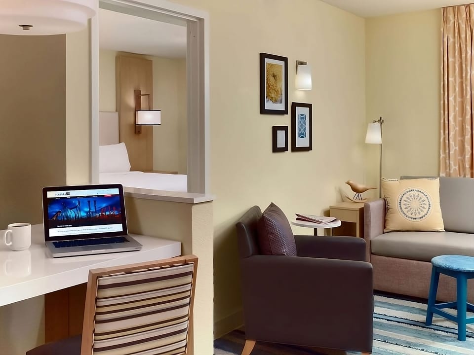 Settle in with a dedicated workspace beside a comfy lounge area.