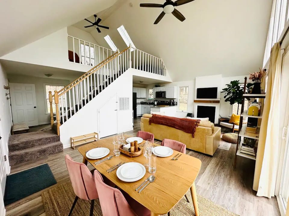 Dining Room, Living Room, Kitchen in Background, and view of the Loft.