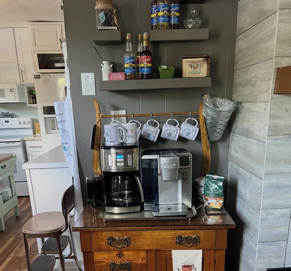 Welcome to our homey coffee cafe' @ White Horse in the Sky's Yellow Cottage.  You have easy access to our mugs when choosing  from our whole beans or  ground variety from our basket of pods.  Treat yourself with a variety of syrups & coffee options! 