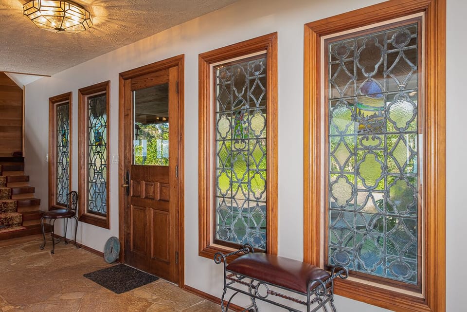 Entryway. Very old leaded stained-glass, well protected.