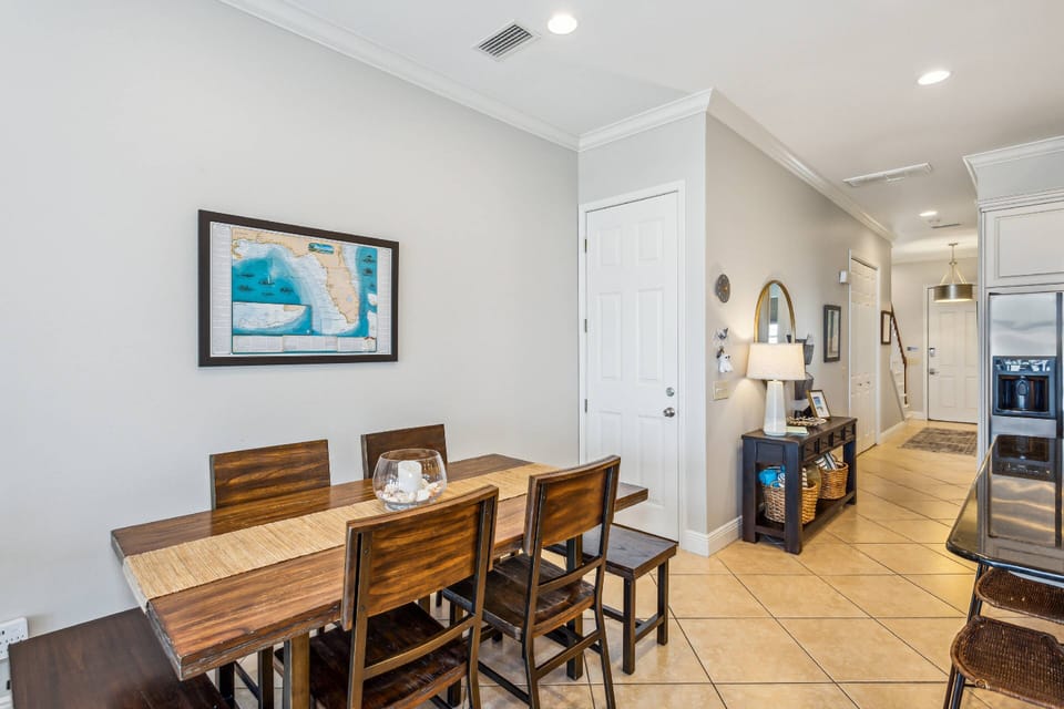 The dining room table has ample room for 6 and the bar has room for another 5