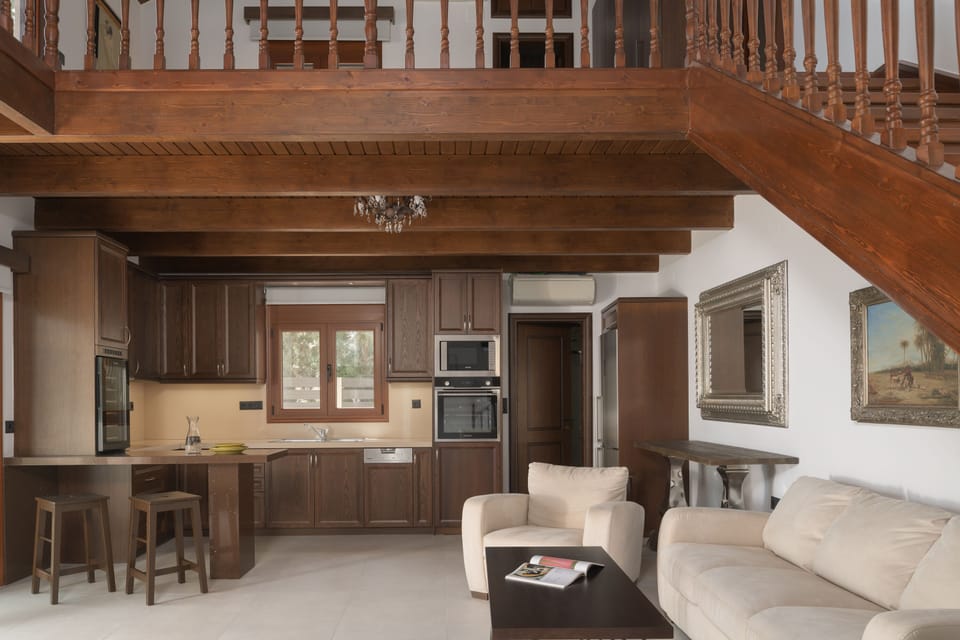 The ground floor features an open plan living room, kitchen & an extra bedroom.