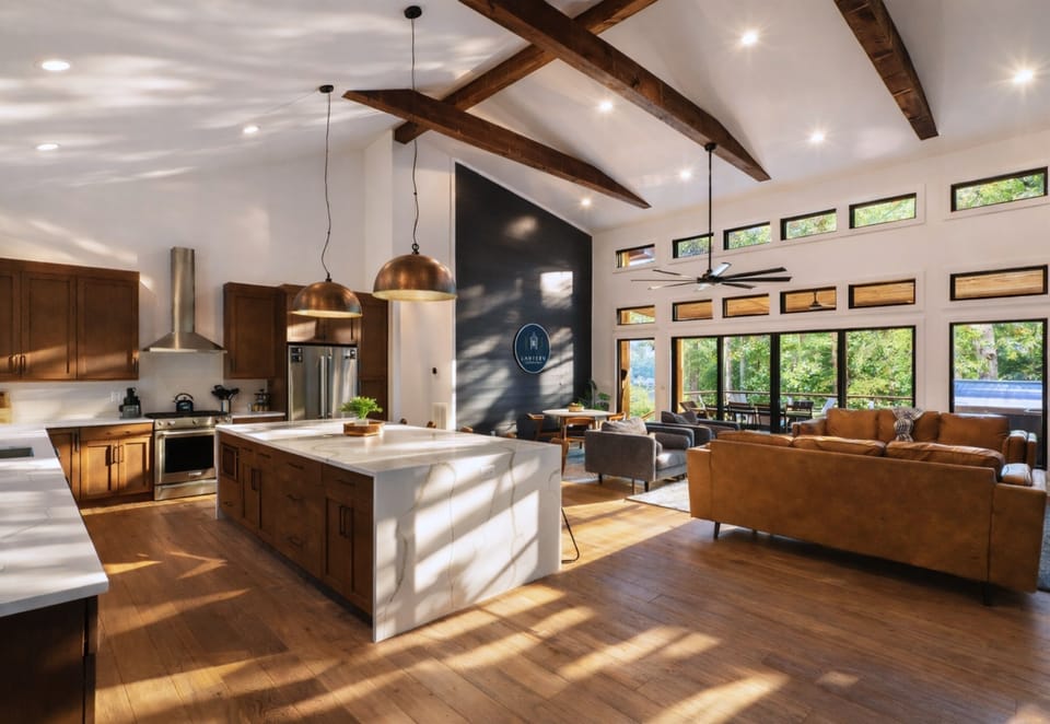 An overall view of the modern kitchen and living area, blending contemporary design with a cozy cabin vibe.