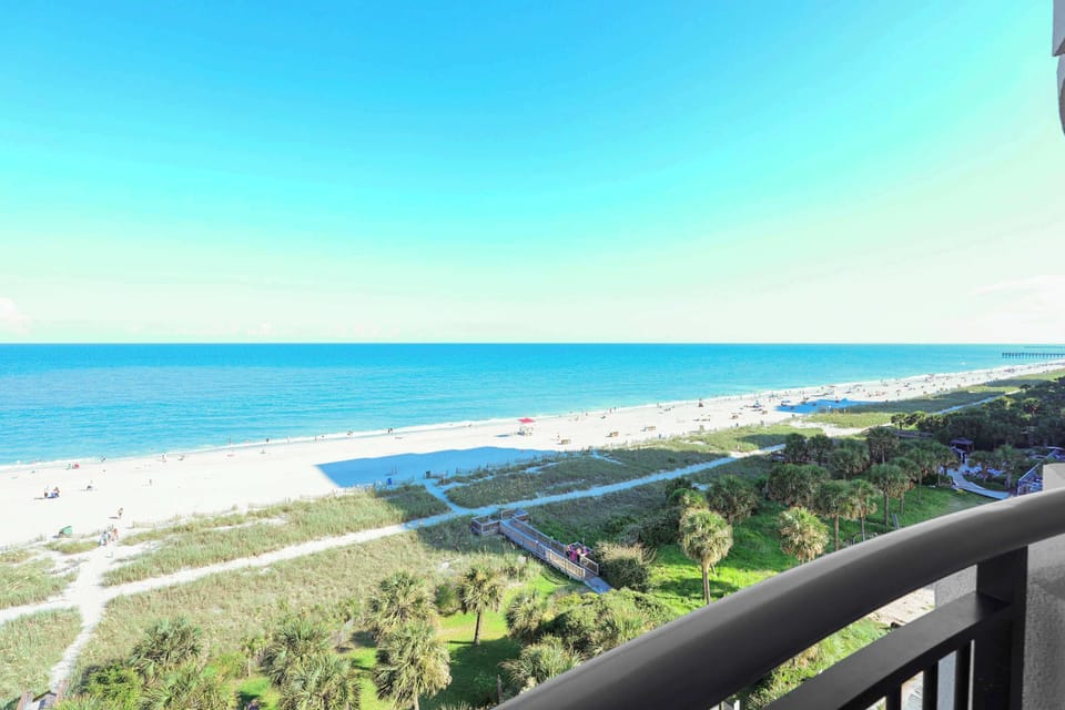 Wake up to stunning panoramic views of Myrtle Beach from your private balcony! Just steps to the sand, this oceanfront Airbnb is your front-row seat to paradise. Perfect for beach lovers and sunseekers!