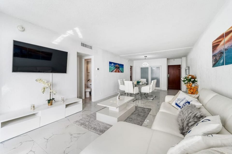 Spacious contemporary living area featuring comfortable seating and sleek design elements