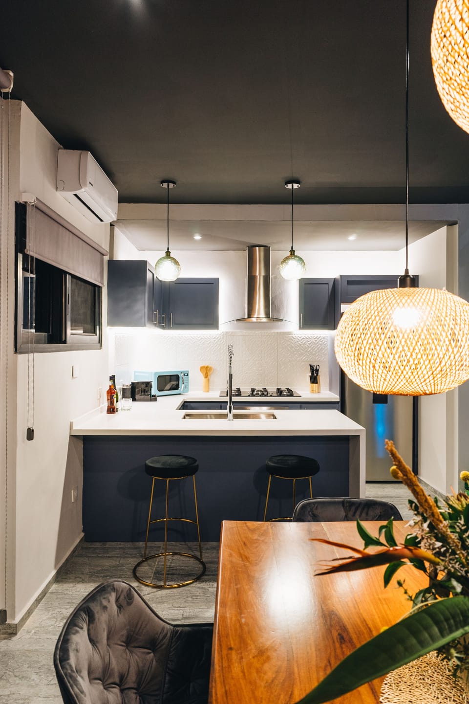 Full kitchen w/ Nespresso machine, coffee, tea, spices, blender, oven microwave, and gas range