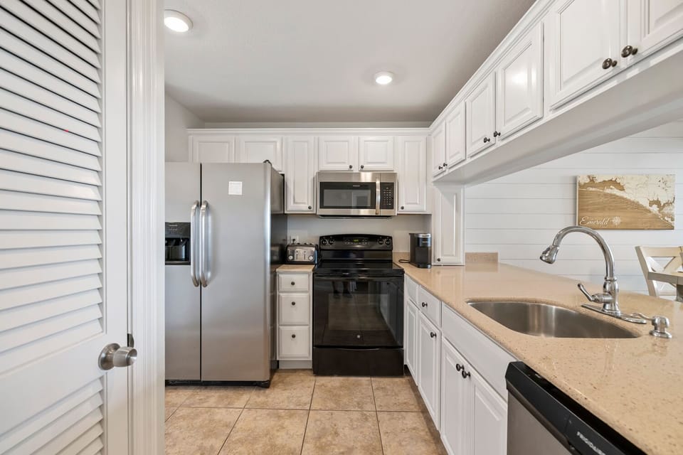 The fully equipped kitchen features all the standard major appliances – refrigerator, stove/oven, microwave, dishwasher.
