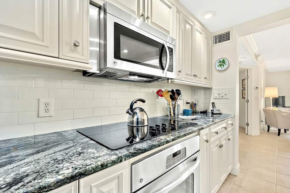 Fully equipped kitchen with modern appliances and ample counter space.