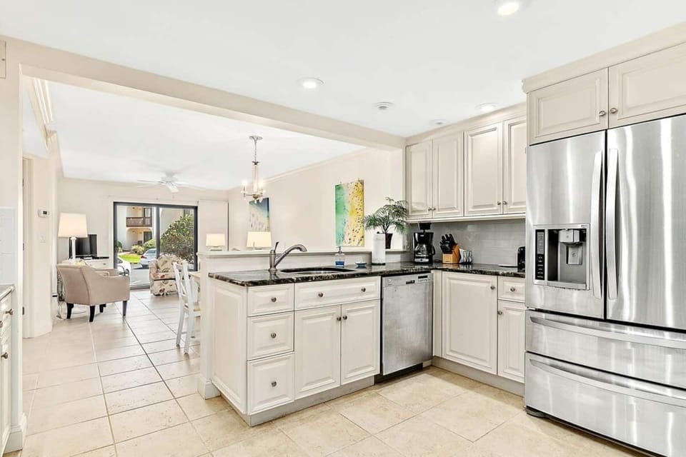 Flow through kitchen, dining area, living room.