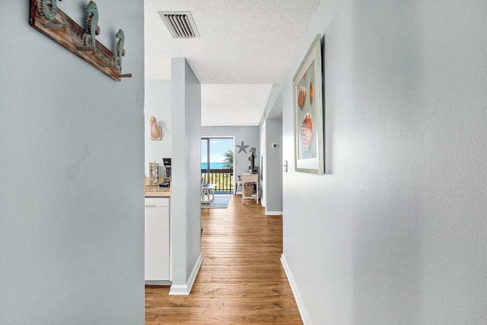 Entrance hallway leads to a private balcony with stunning views of the ocean.