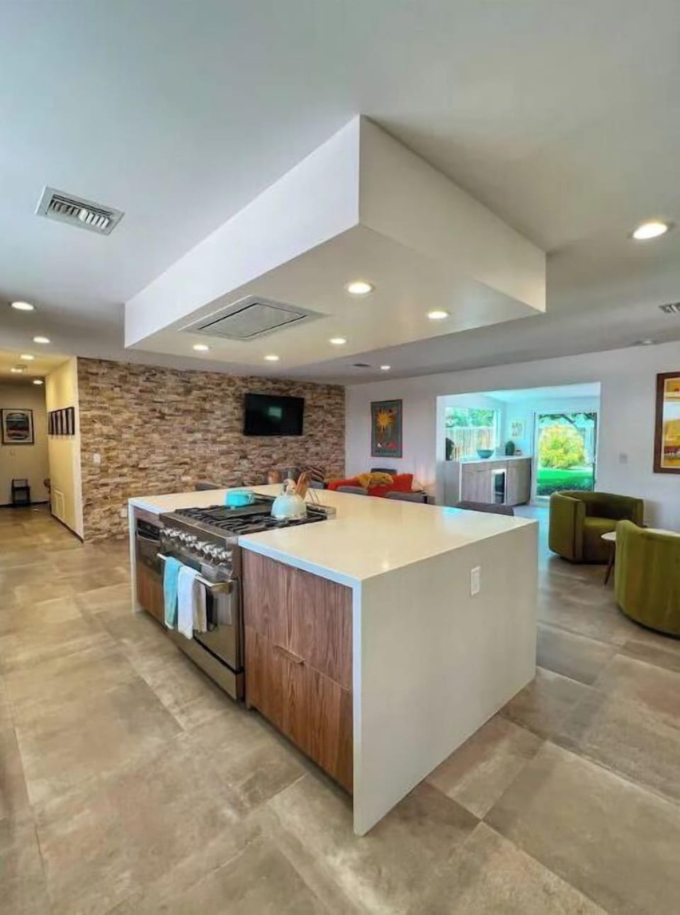 Kitchen - Central island with gourmet 6 burner gas stove and microwave