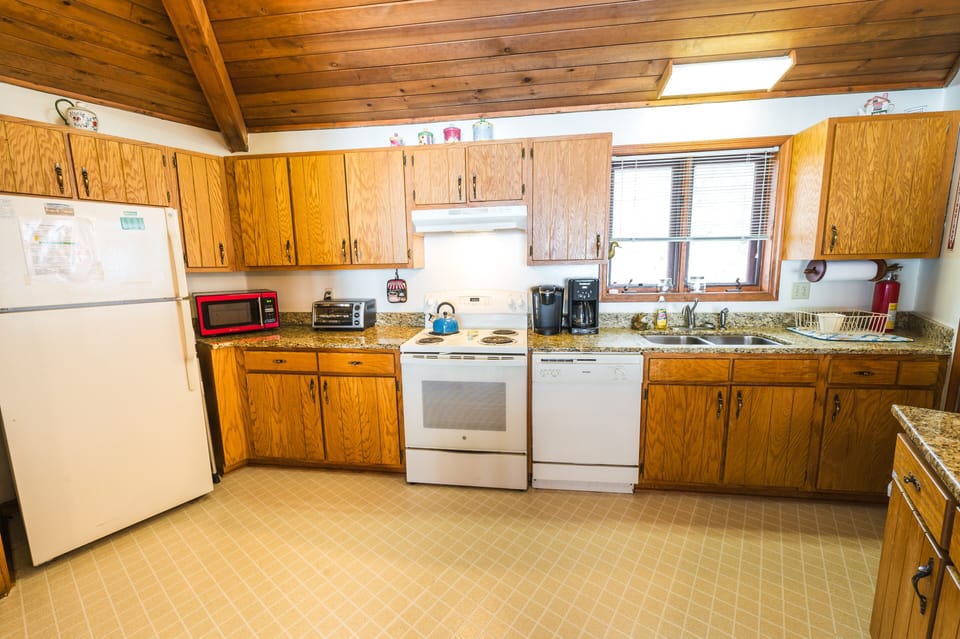 Fully equipped kitchen with modern appliances and ample counter space.