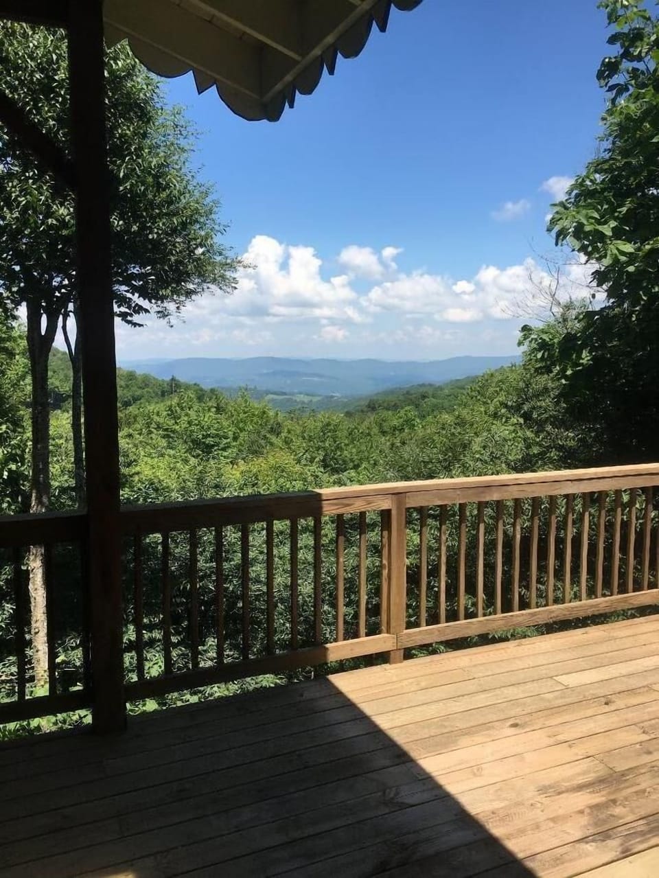 Spacious wooden deck with breathtaking mountain views and fresh air.