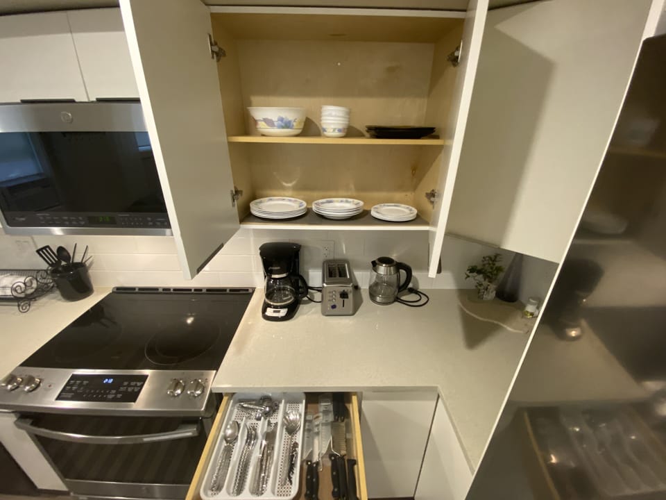 Coffee maker, toaster, and dishes

