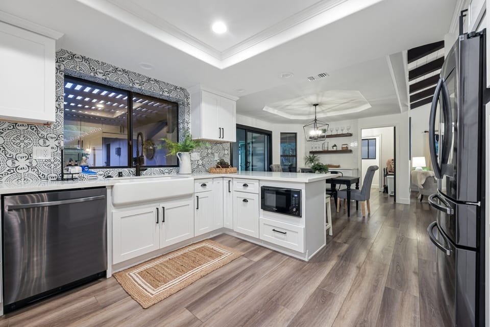 The kitchen in the main house has all new appliances and a farmhouse sink.