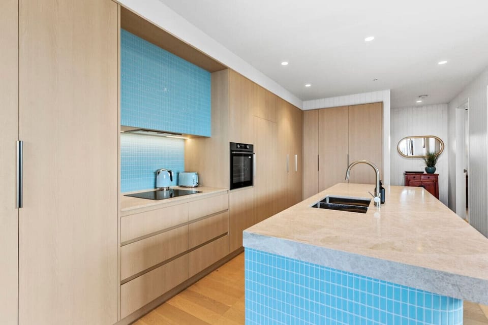 Open plan kitchen, living and dining with high end appliances