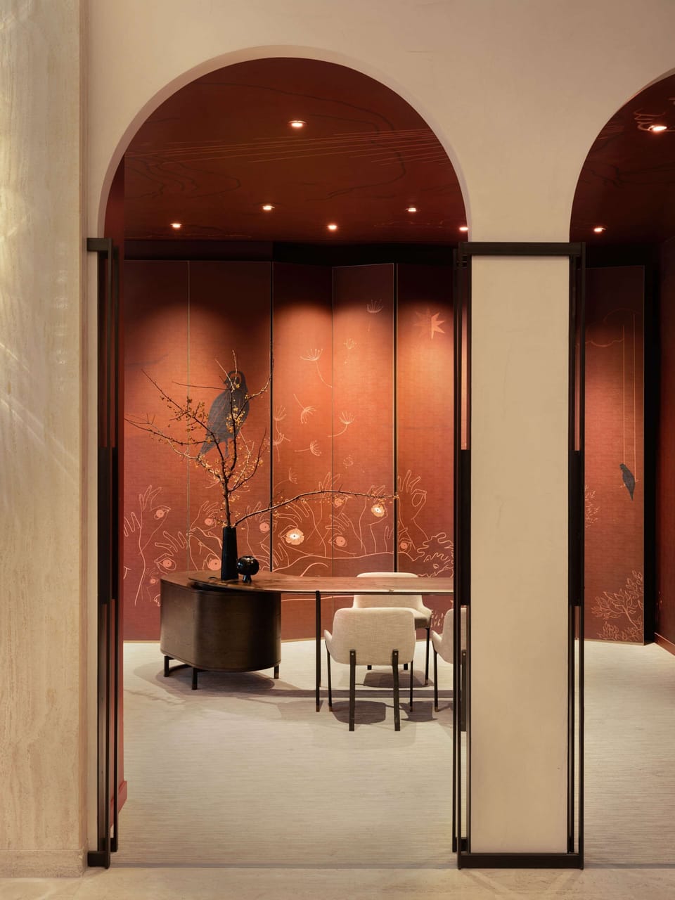 Step into a sophisticated lounge framed by graceful arches.