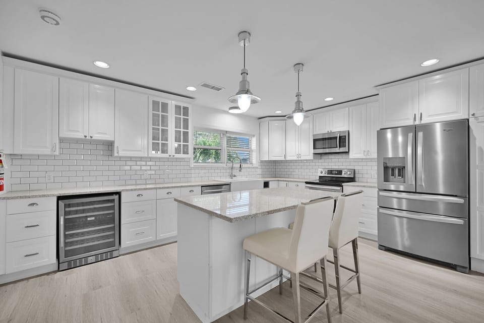 Modern kitchen with new appliances and breakfast bar that seats 2
