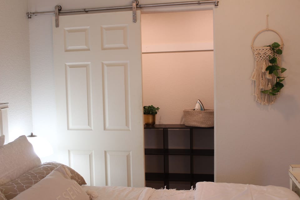 Full size walk in closet with shelves 