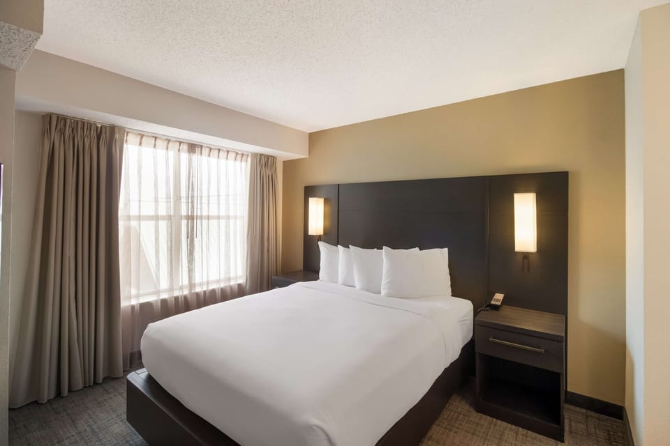 Unwind into crisp linens and soft, calming light.