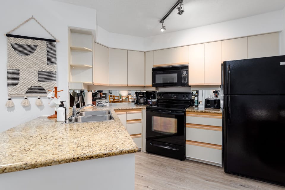 Kitchen- Fully stocked spacious kitchen with all the cooking necessities