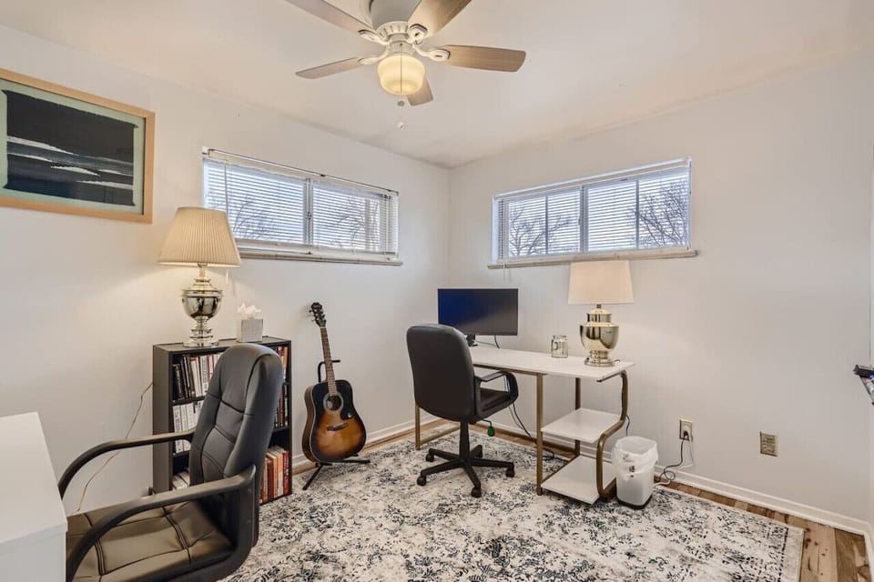 This office comes complete with two desks and two extra monitors for remote workers!