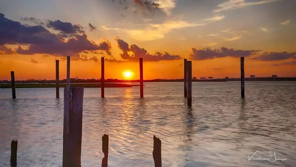 Grab your favorite drink & take a short walk to watch the sunset from the Bay.