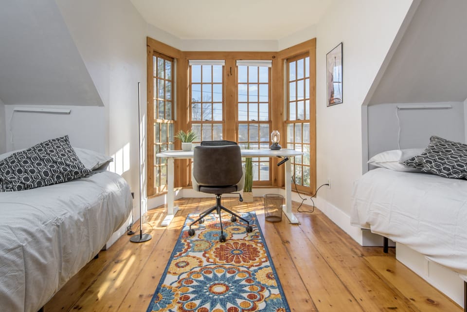 2nd floor bedroom with two twin beds and second office desk