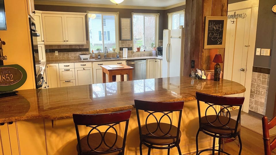 View from breakfast bar into kitchen.