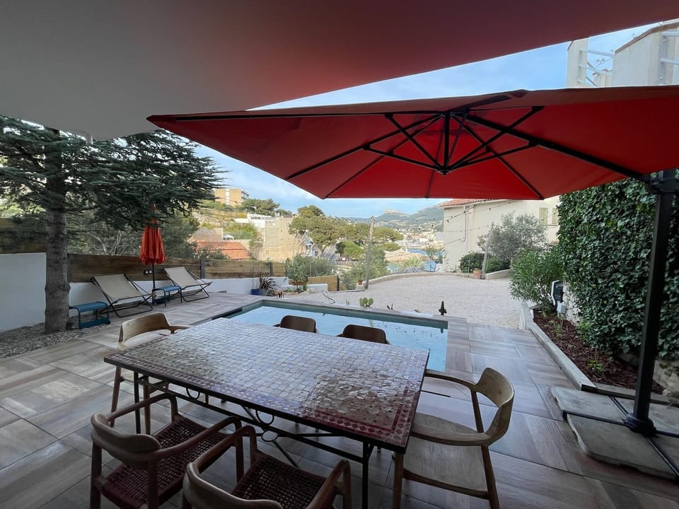 Dining area from Bestouan Beach Suite with pool and cassis and port sea view