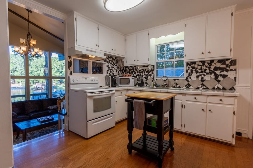 Kitchen with views of Dock and lake.  Fully stocked.  (no dishwasher)