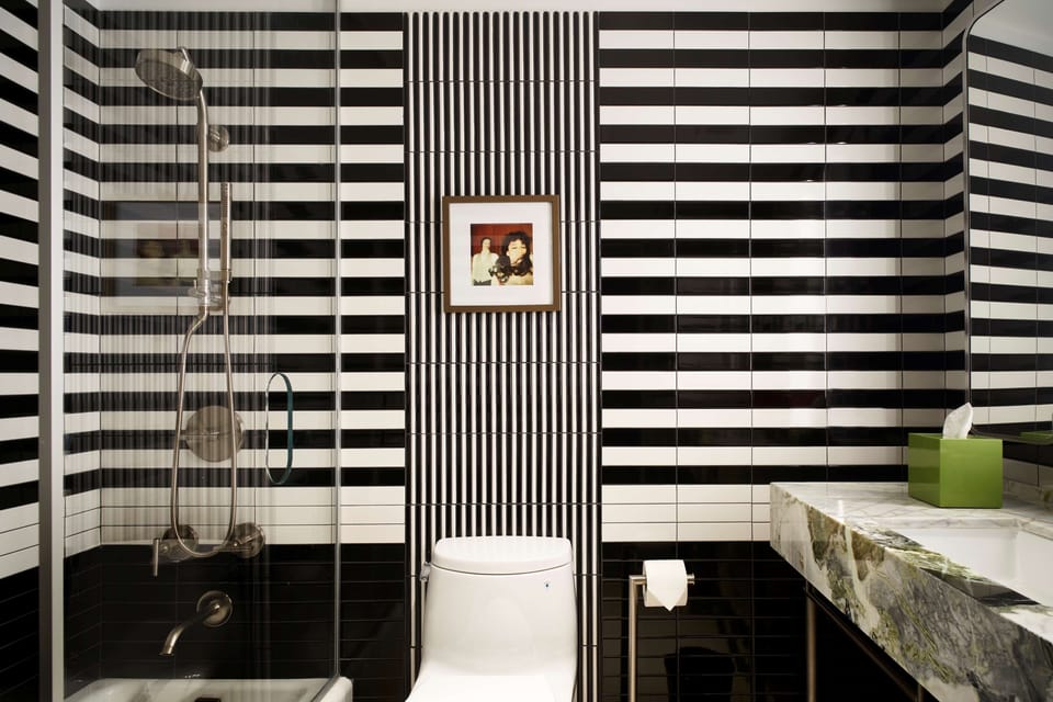 Rinse off in a sleek glass shower with bold, modern tile.