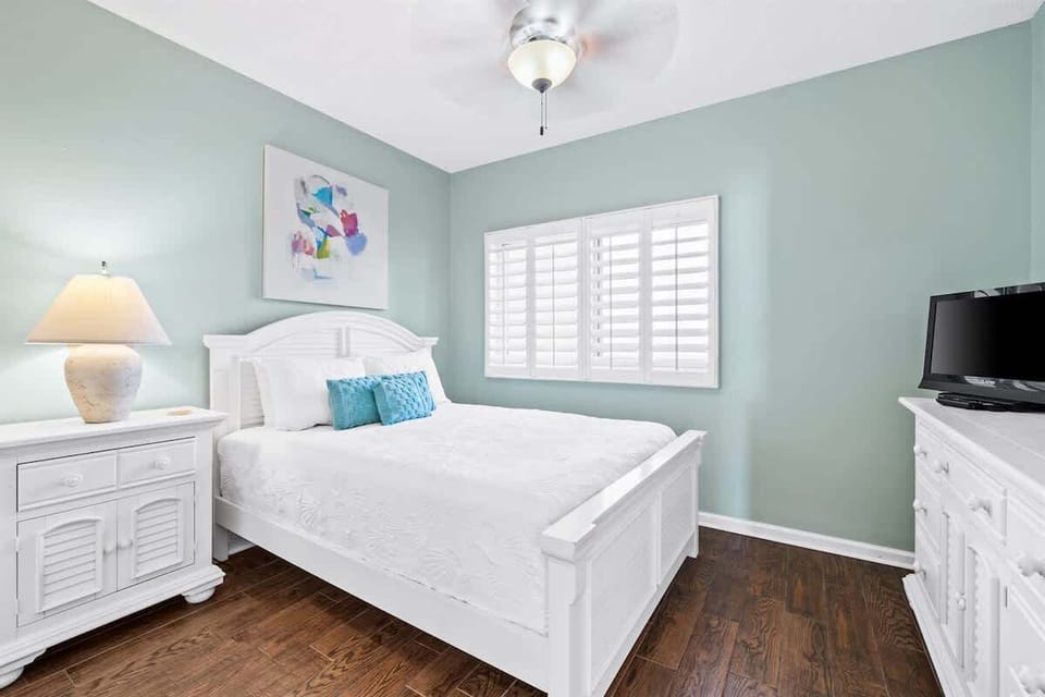 Bedroom 2 - Cozy Queen bed with ample storage space in the closet.
