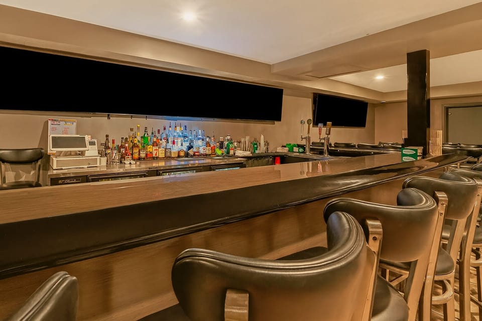 Sip cocktails at the sleek on-site bar after exploring.