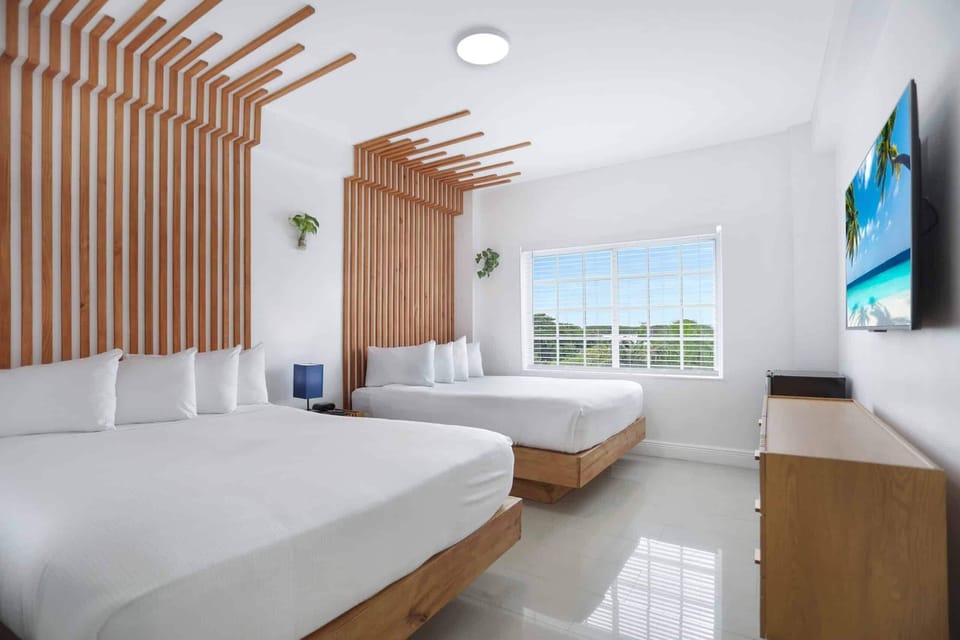 Wake up refreshed beside sunny windows and crisp linens.
