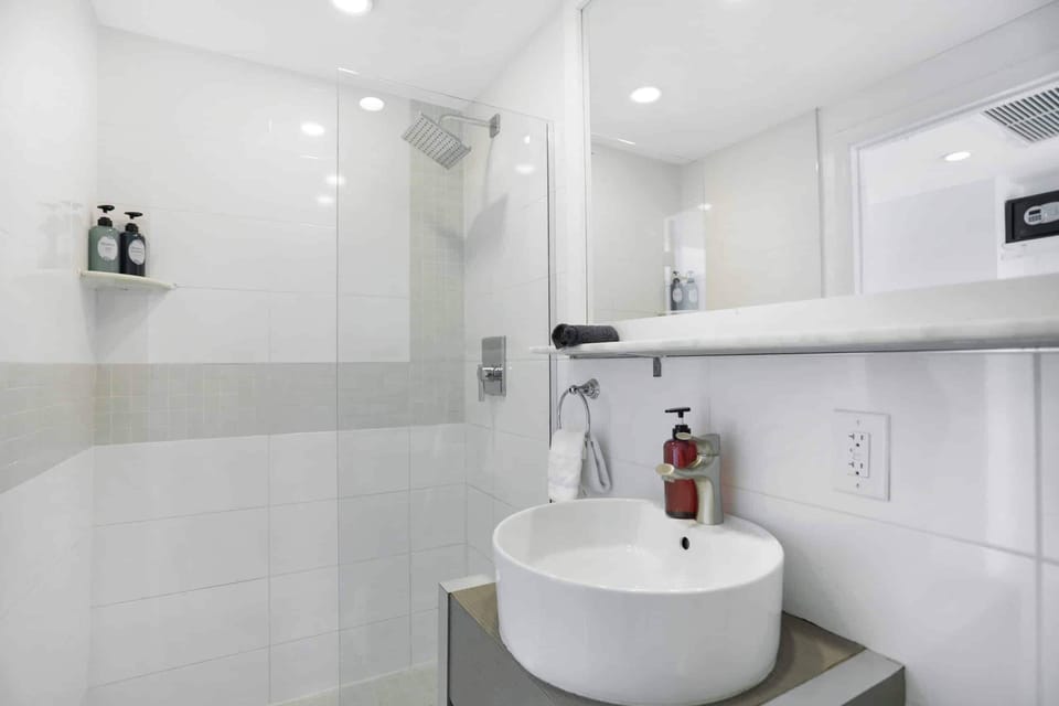 Refresh in a spotless glass shower with rain-style head.