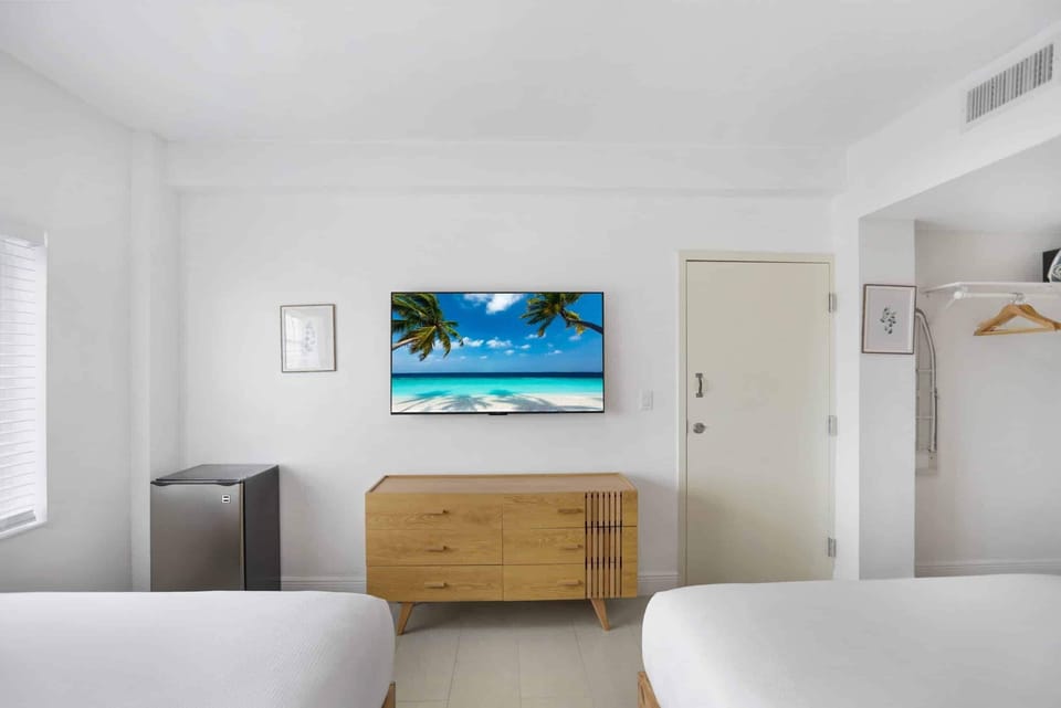 Settle in for movie nights with TV and sleek dresser.