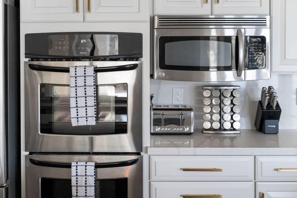 Double oven, microwave, toaster,  spices.