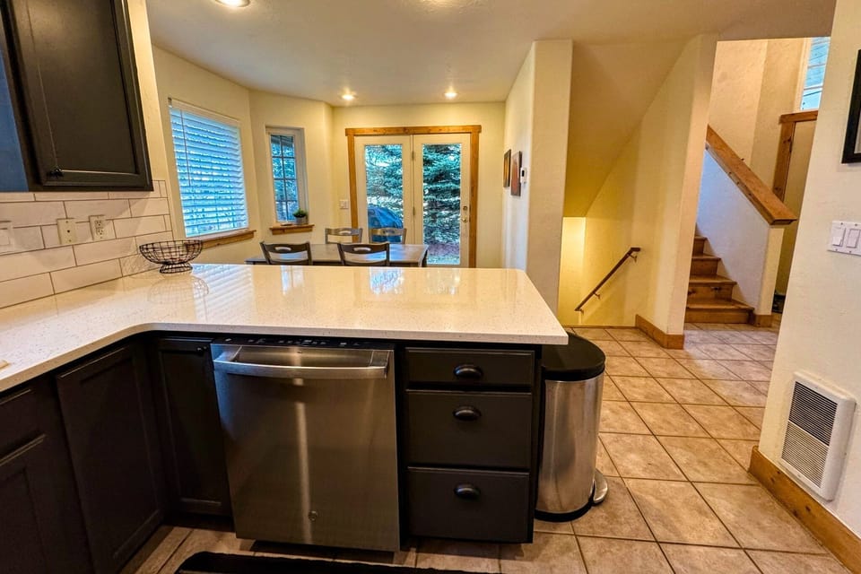 The dining area is connected to the kitchen, making meal prep and clean-up a breeze.