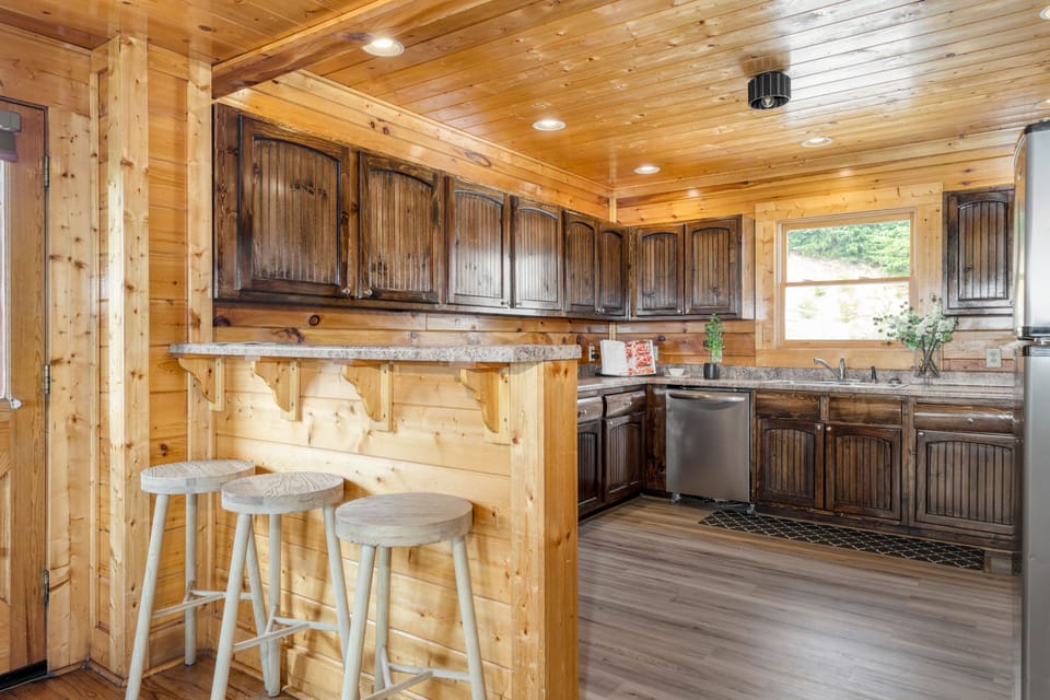 Charming, rustic kitchen with barstool seating and tons of space.
